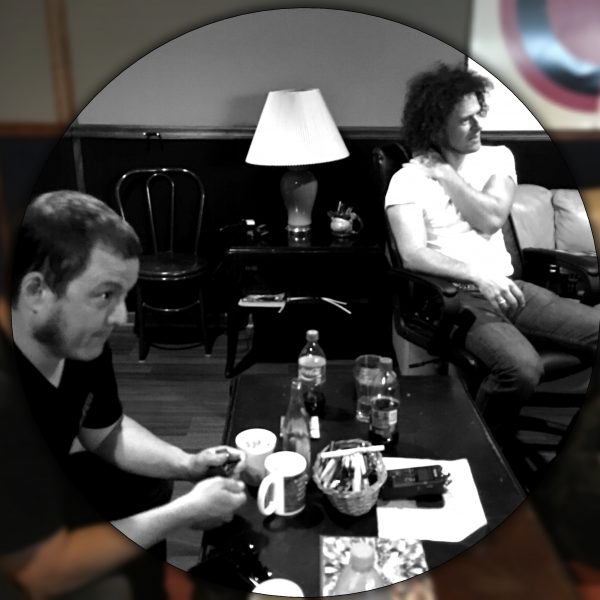 Listening to new tracks at County Q Studios.  Photo by Skipp Frazier